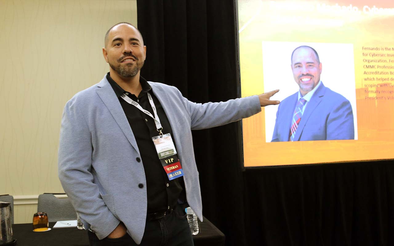 A man standing in front of a picture