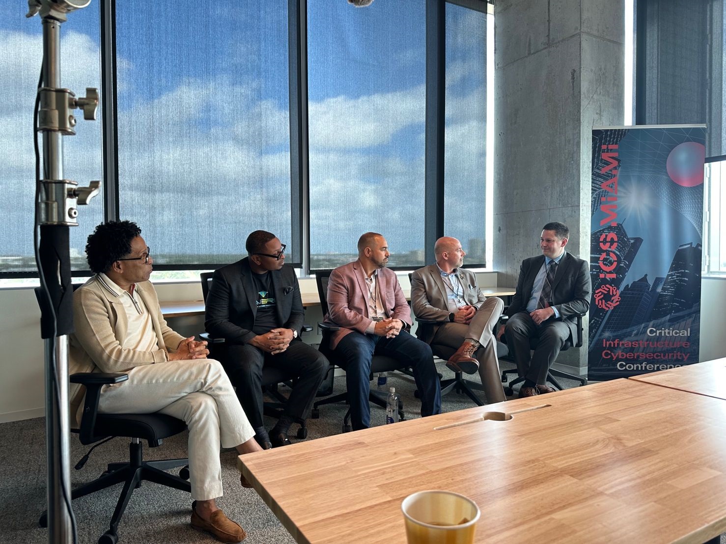 A group of people sitting in a board room