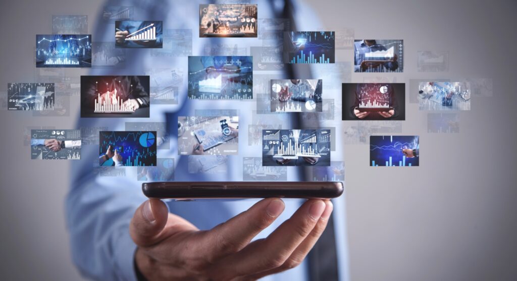 Hand holding smartphone with floating finance dashboards