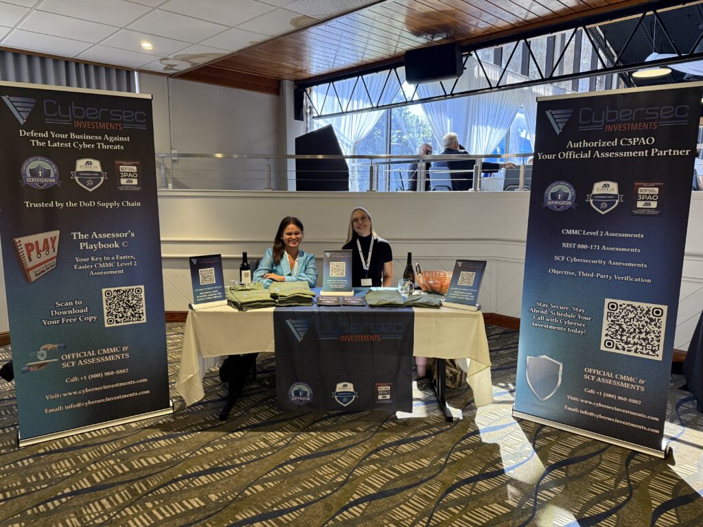 Two women at cybersecurity investments booth